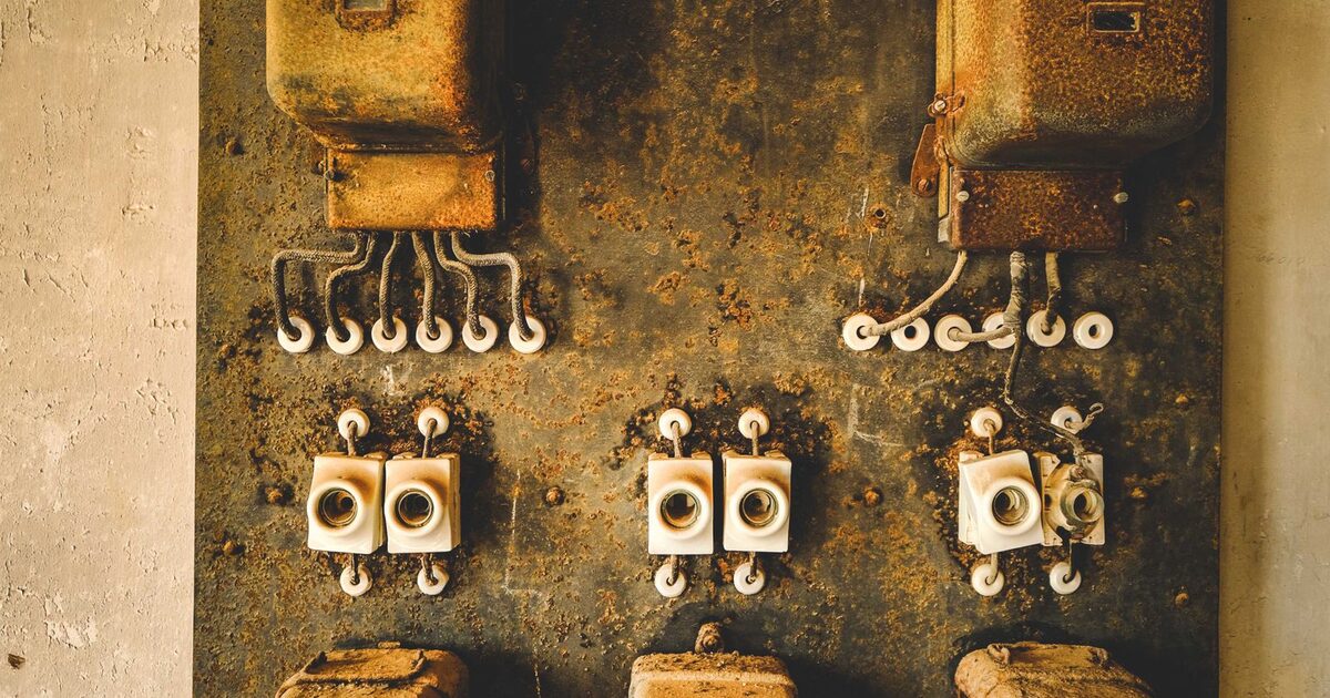 Older electrical panel fitted with fuses, meters and control equipment