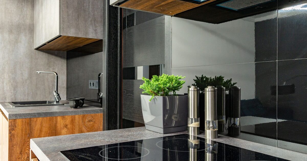 Modern kitchen with an induction cooktop and stainless steel fixtures